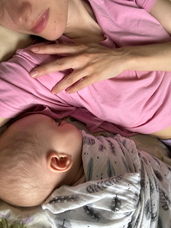 Parent and baby rest together in Moscow morning scene