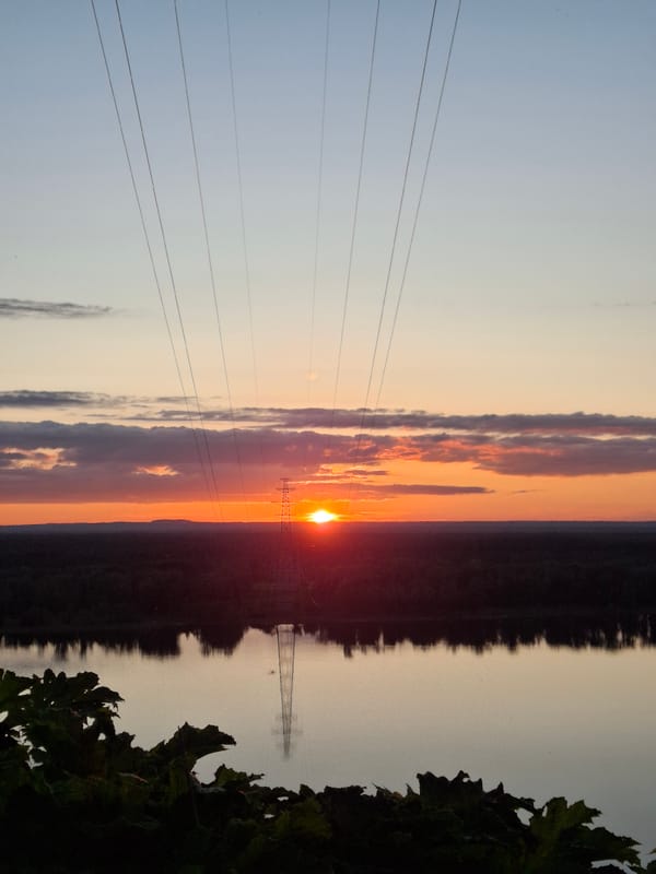 Sunset documented along Chaykovsky river through forests and portraits