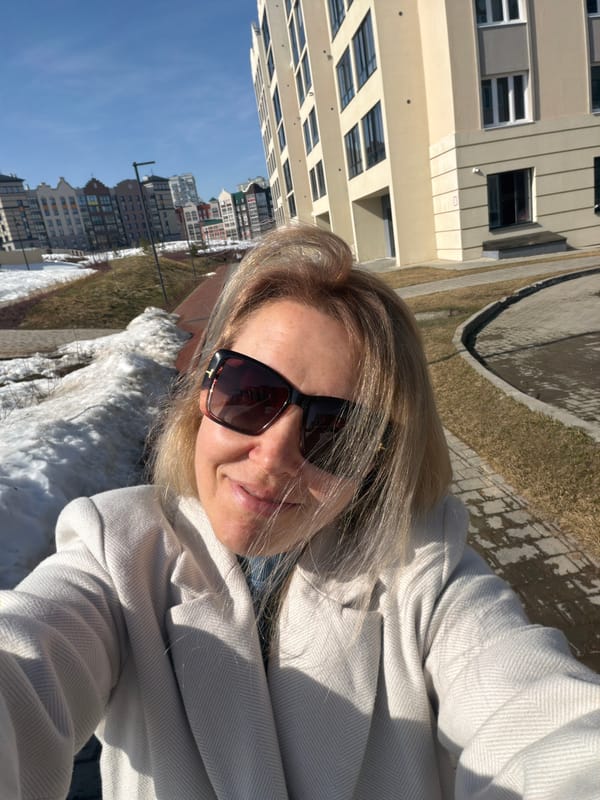 Woman takes selfies on street in Pervomaysky, Russia