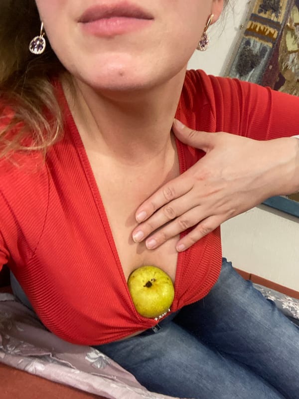 Woman poses with pear in casual Yekaterinburg photo session