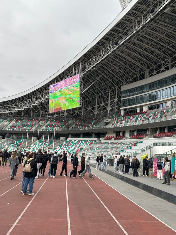 Stadium crowd watches soccer broadcast at Dinamo Stadium Minsk