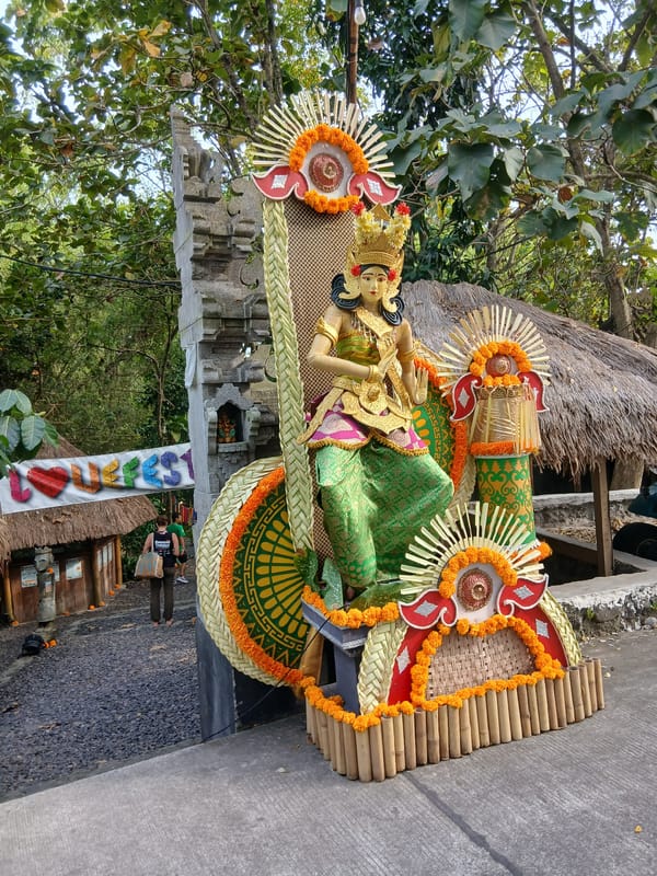 Decorated Balinese statue and garden pathway in Kediri