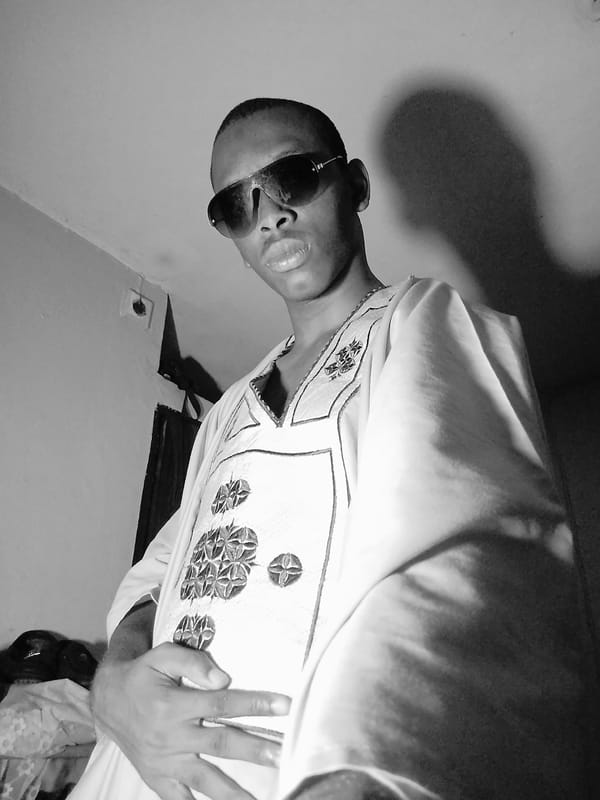 Lagos bedroom portrait session in traditional embroidered buba