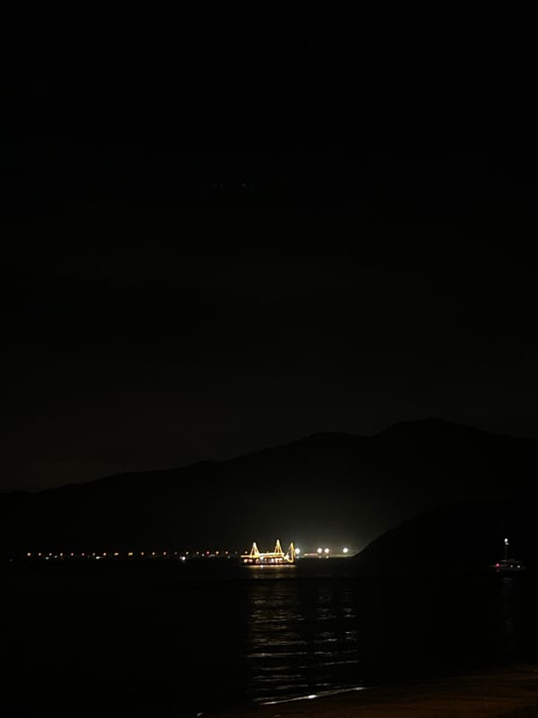 Nighttime celebration scenes captured at Nha Trang waterfront cafe