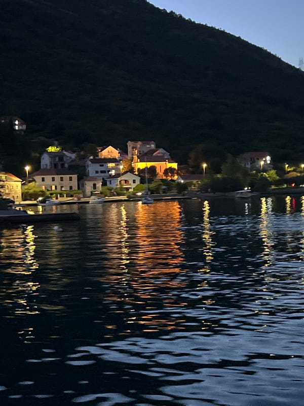 Dusk falls over a quiet Montenegrin bay village