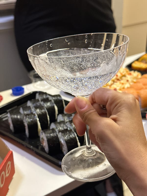 Pizza, sushi, and champagne at a casual Irkutsk get-together