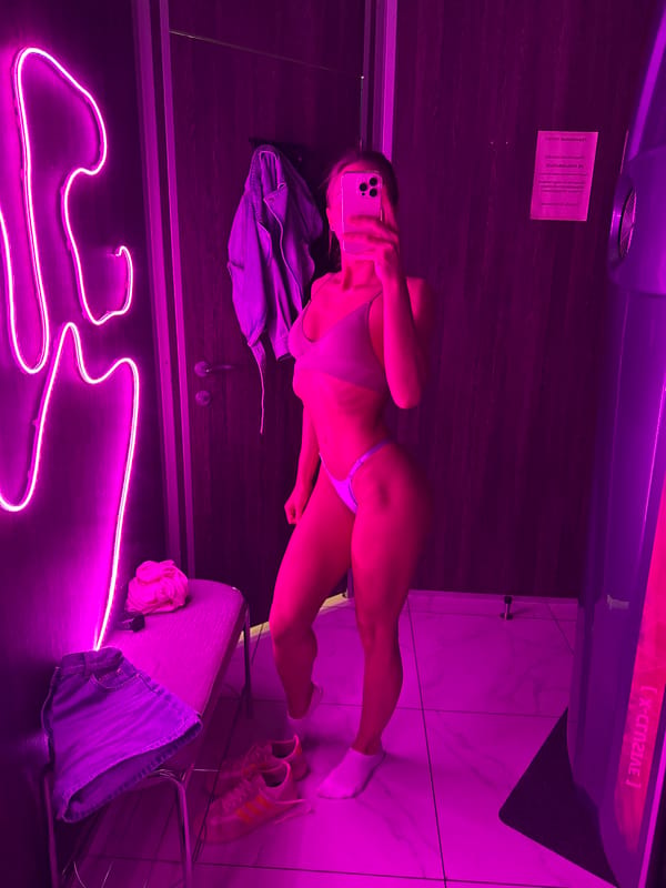 Woman takes selfies in Saint Petersburg tanning salon, retail locations
