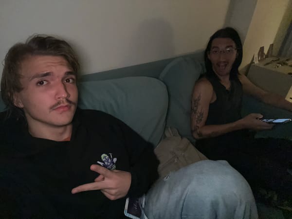 Two men sitting on sofa in Thai municipality