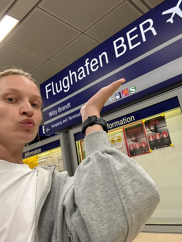 Woman documents visit to Berlin Brandenburg Airport terminal, platform