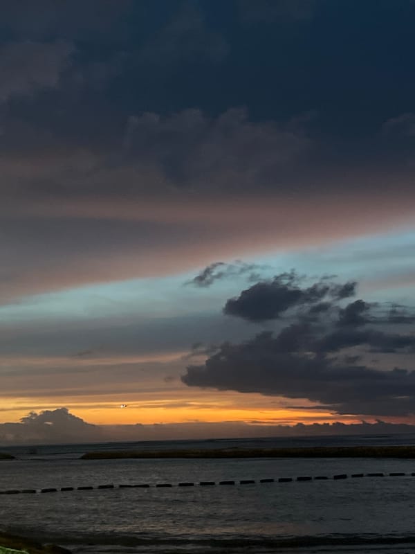 Dramatic sunrise captured over water in Kuta, Indonesia