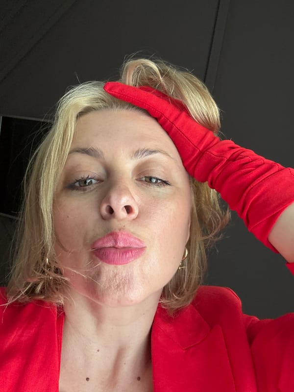 Red-jacket selfie session in Sochi, with a rooster cameo