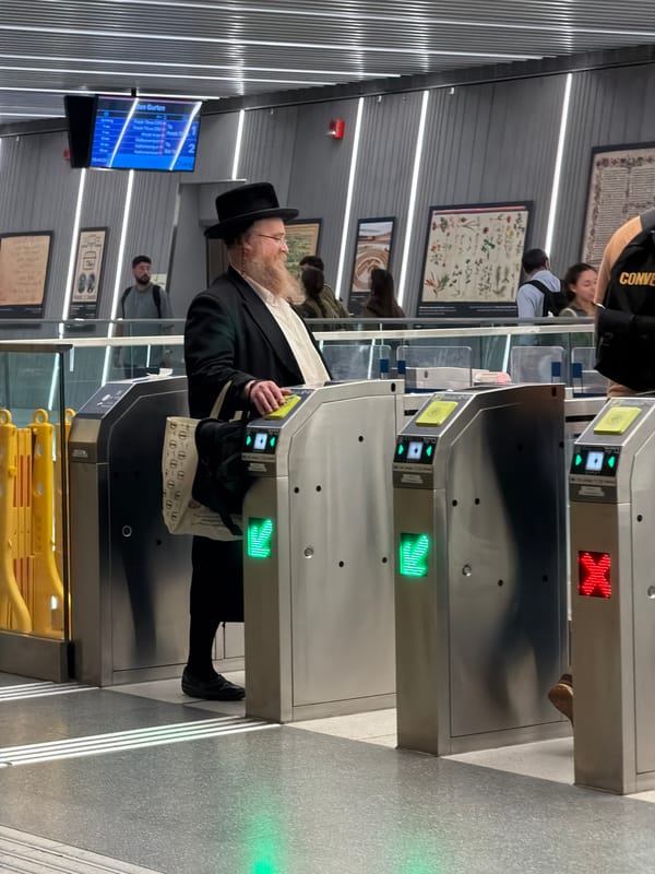Rush of commuters through Bnei Brak's turnstile-gated station