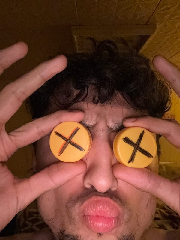 Kittens and bottle-cap eye gags in a casual indoor session