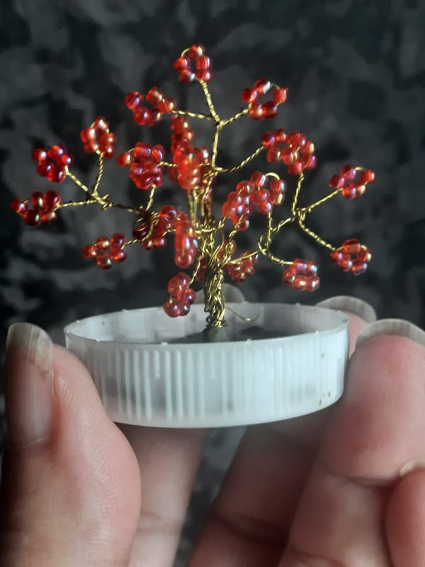 Handmade beaded tree ornament displayed in Sluck, Belarus