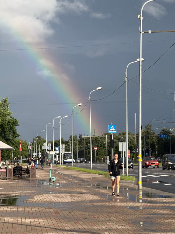 Rainbow over wet Riga streets after a summer rain