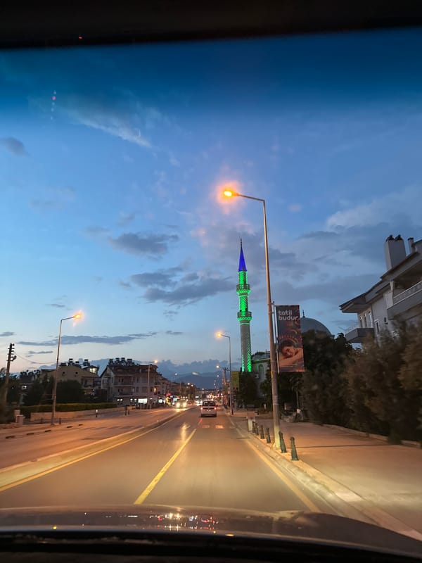 Illuminated mosque minaret observed at dusk in Fethiye