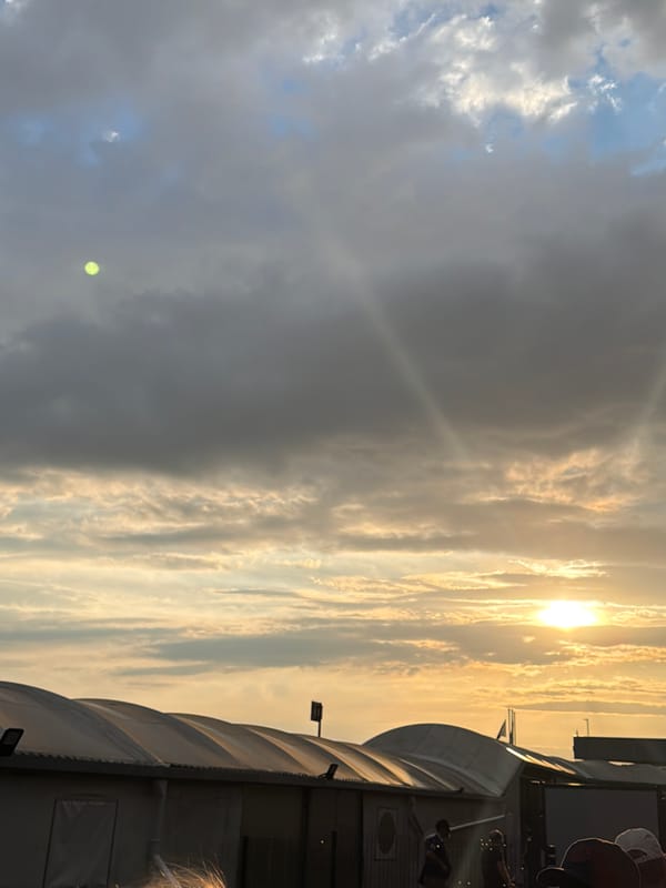 Evening queue outside Beauvais-Tillé Airport under a golden sunset