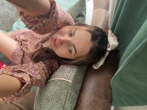 Couch selfie session with close-ups of outfit and wrist tattoo