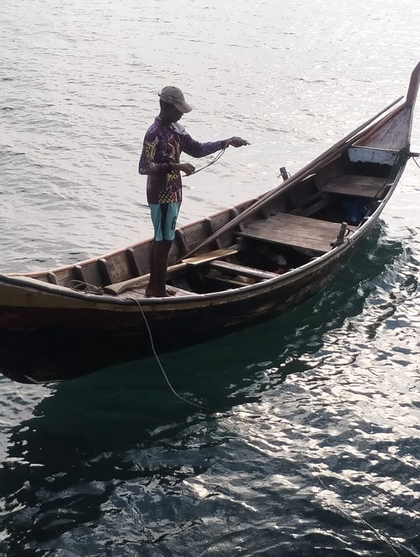 Sunset fishing scene captured along Lhokseumawe coastline