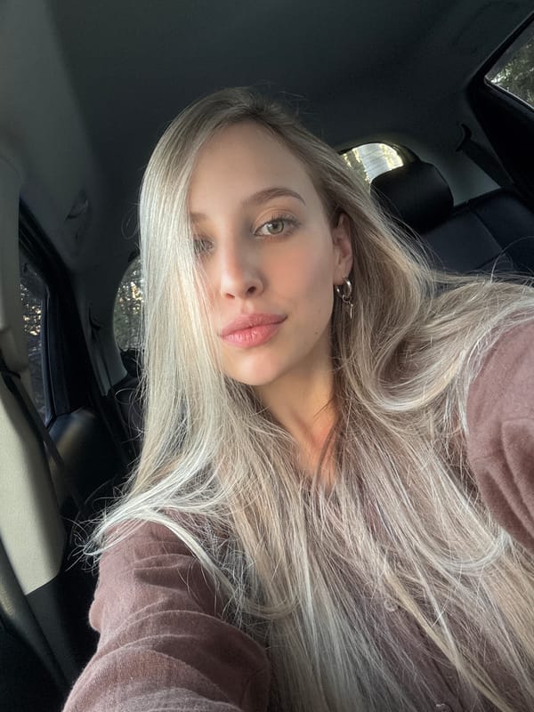 Selfie moment in a car amid Krasnoyarsk forest surroundings