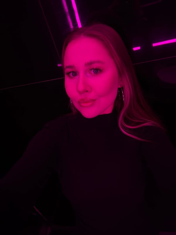Mirror selfies and Scotch in a purple neon venue, Yiwu