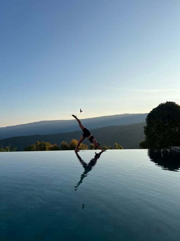 Sunset yoga session at Indonesian infinity pool resort