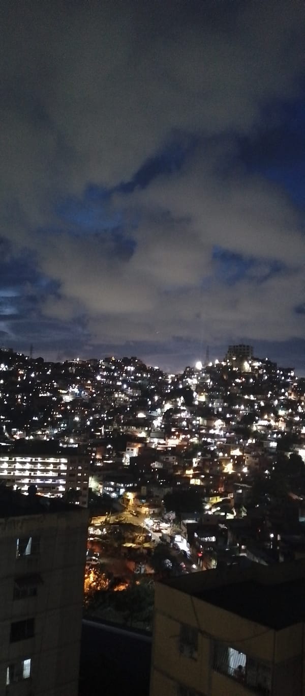 Caracas nighttime cityscapes and domestic cat scenes documented