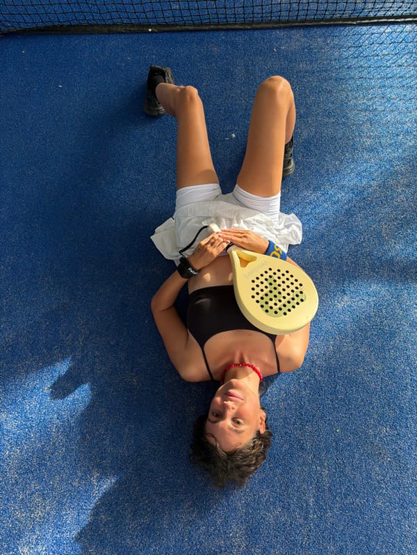 Woman lying on padel court in Jimbaran, Indonesia