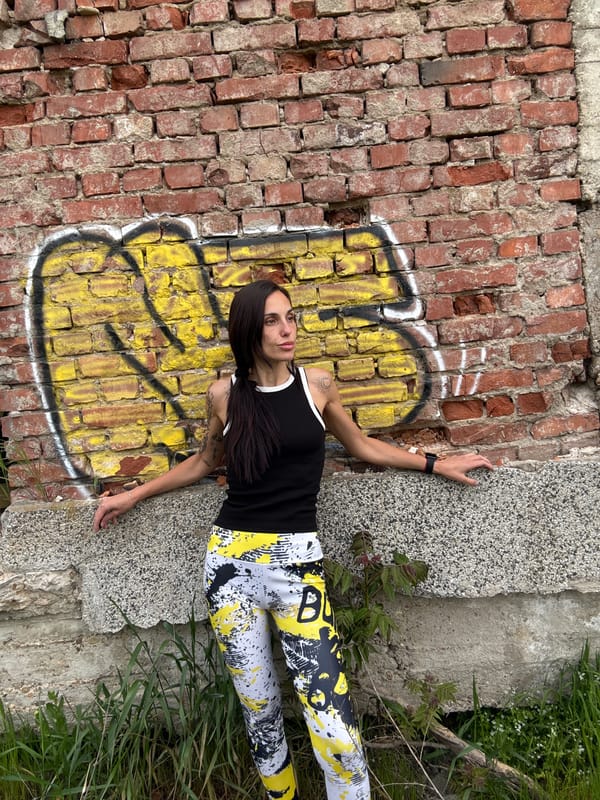 Woman rests in urban Pleven wearing distinctive patterned clothing