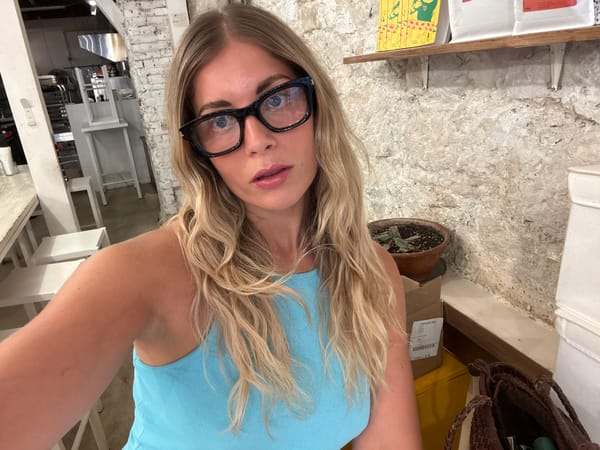 Selfies at a Paris café, baguettes on the table