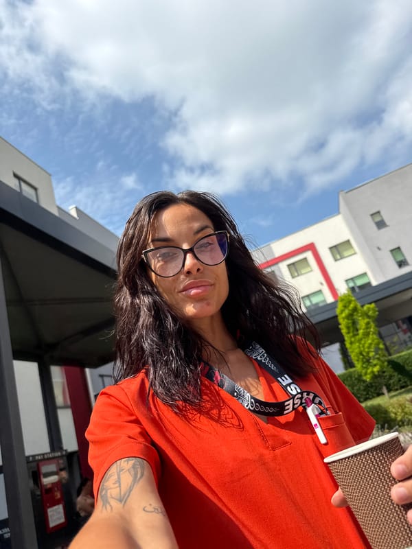 Morning coffee stop in Pleven, lanyard and orange top