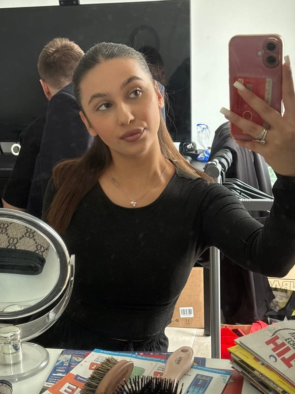 Woman takes mirror selfie with companion in Mönchengladbach