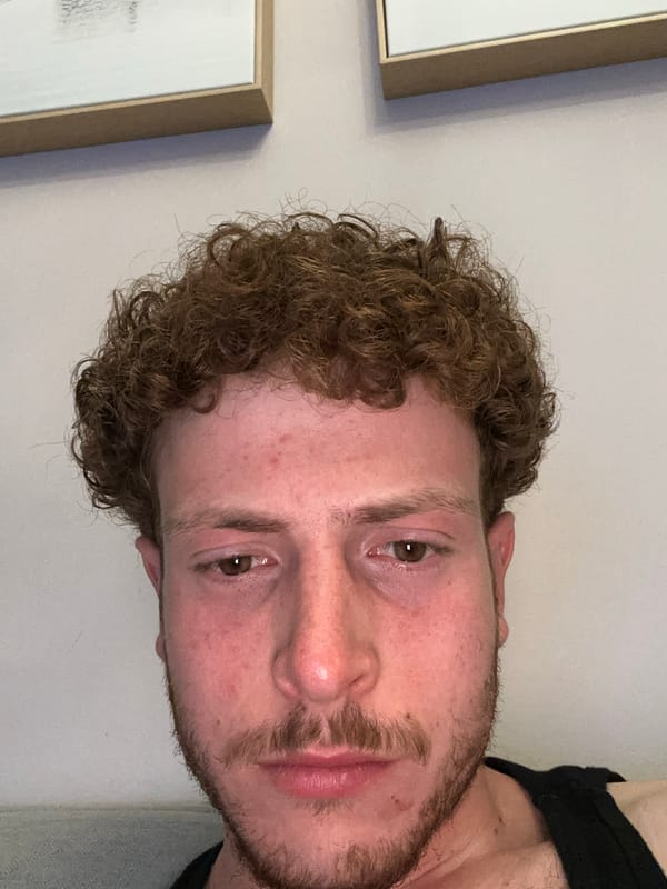 Man rests on couch in New York apartment