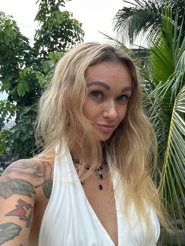 Tourist takes selfies in Mũi Né garden area