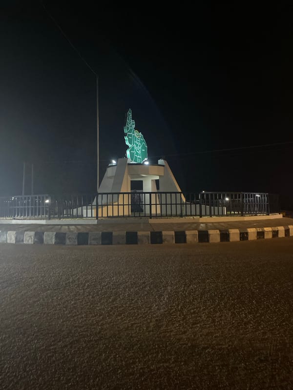 Illuminated Nigeria map monument photographed at night in Bukuru