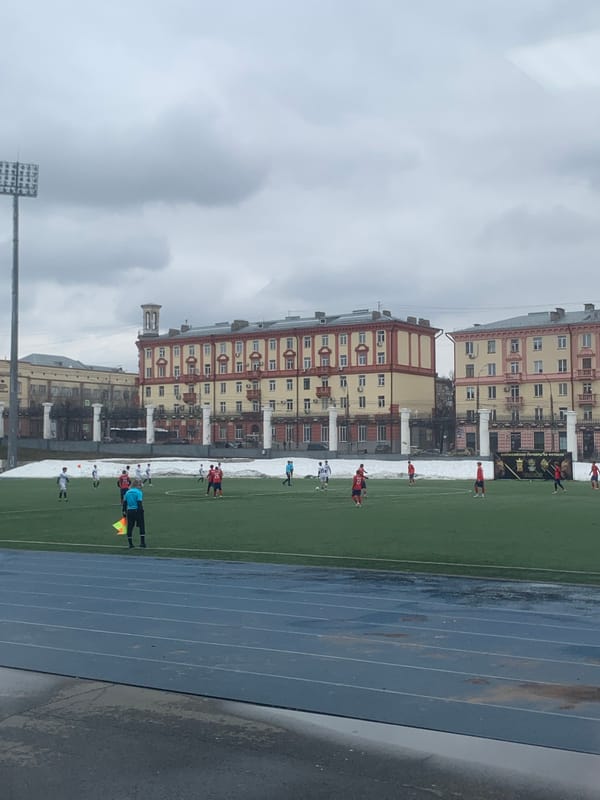 Soccer match underway in Izhevsk under overcast skies