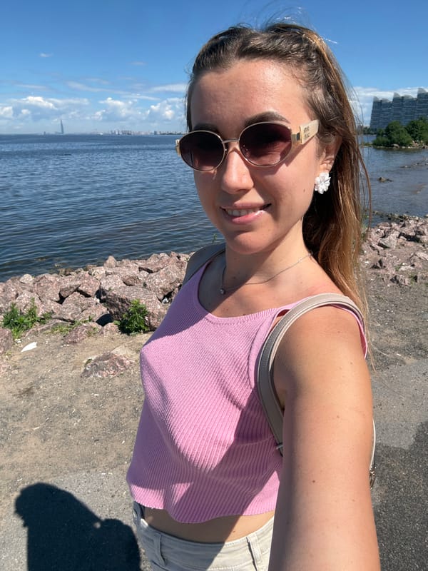 Waterfront bike stop, selfies, and a calm bay on a sunny morning