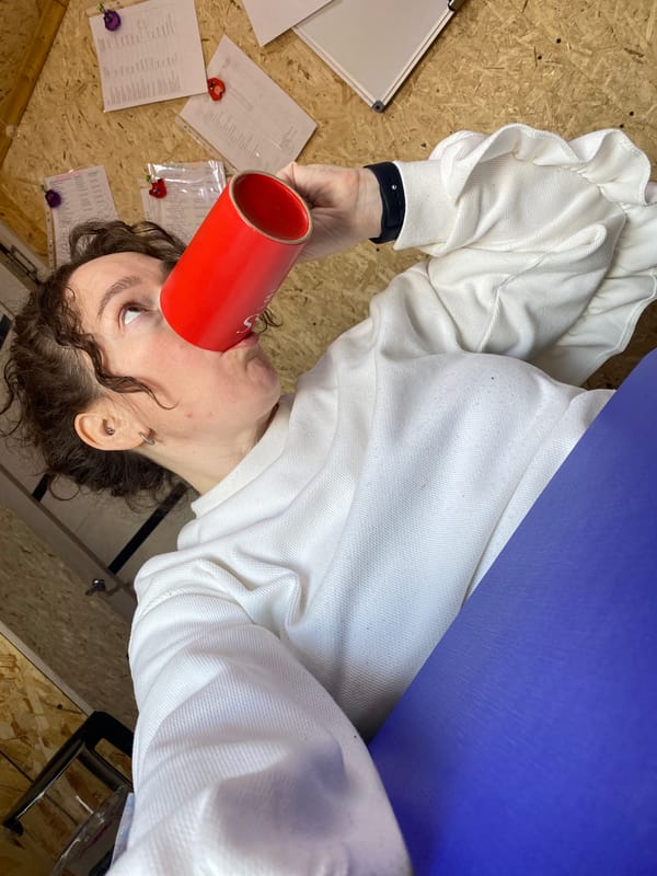 Woman takes selfies with coffee in Ol'khovskoye office