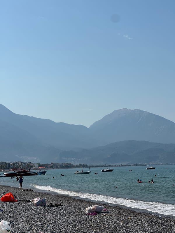 A relaxed morning swim session on a Fethiye pebble beach.
