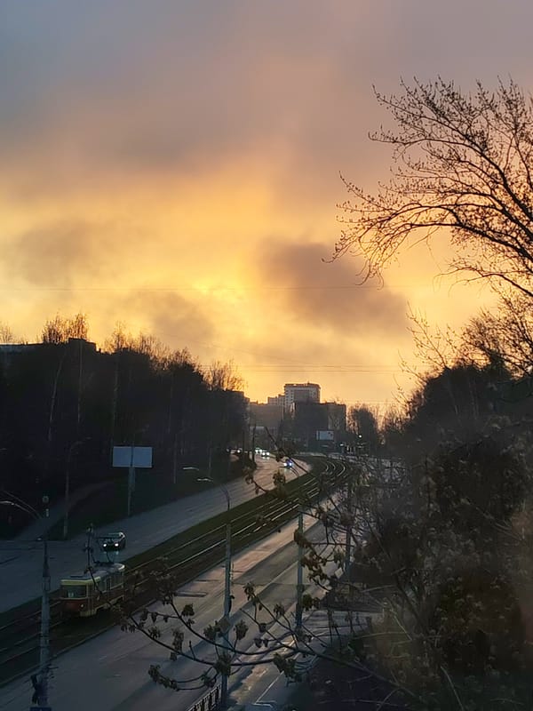 Dramatic sunrise/sunset illuminates Izhevsk streets and tram lines
