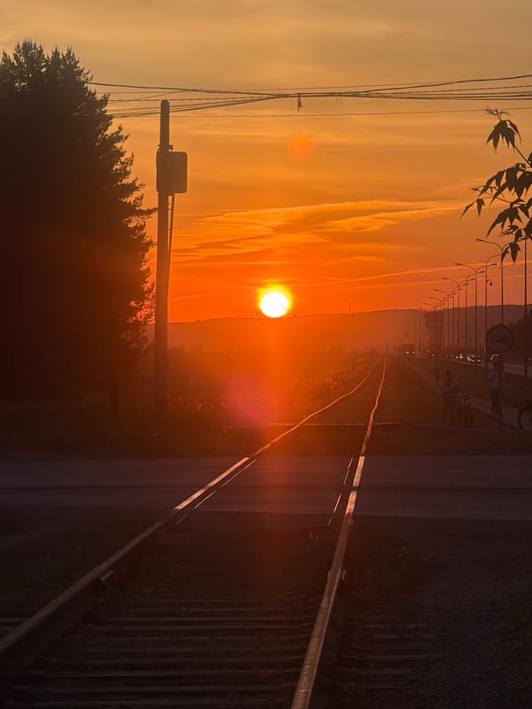 Sunset captured along railroad tracks in Chaikovsky, Russia