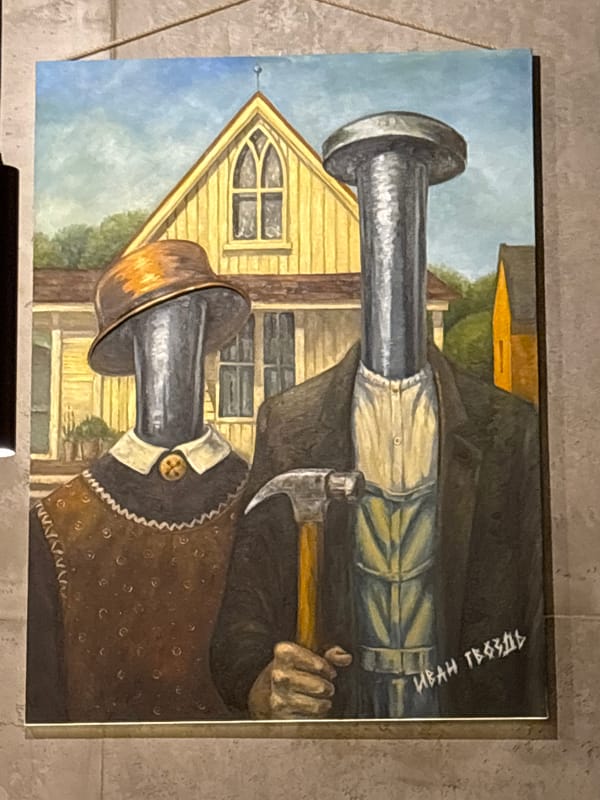 Art display features hammer painting and Munch-style artwork