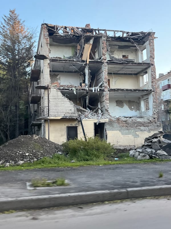 Damaged building with exposed interior documented in Kryvyi Rih