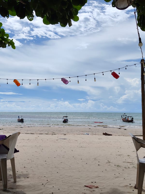 Lazy beach morning in Sakhu with kites, noodles, and overcast skies