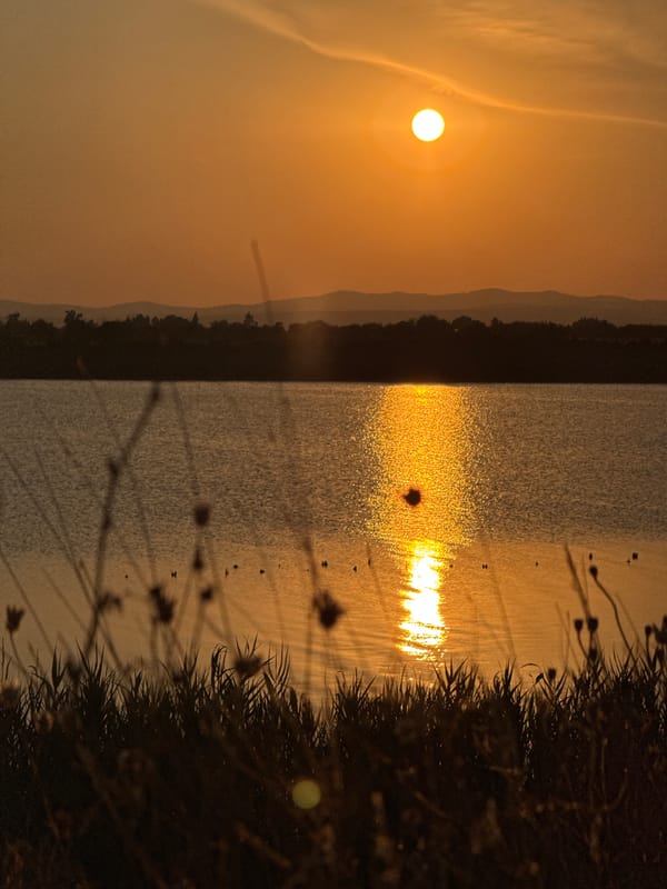 Sunset light over Pomorie's lake and beach shoreline