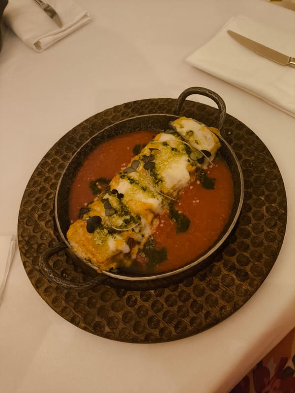 Diner documents restaurant meal with pink cocktails and cheese dish