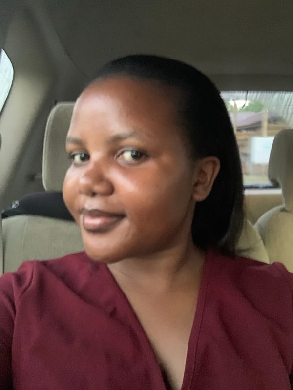 Woman photographed in vehicle interior in Dar es-Salaam