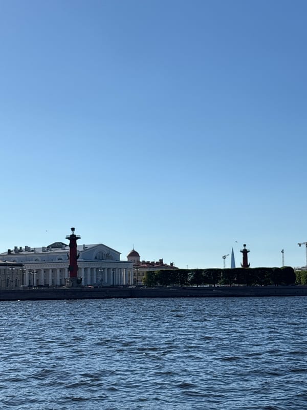 Tourist documents sunny afternoon walk through historic Saint Petersburg