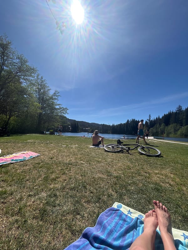 Swimmers enjoy evening sunshine by Whistler waterfront