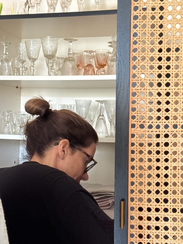 Woman in white sweater observed indoors in Vila Nova de Gaia